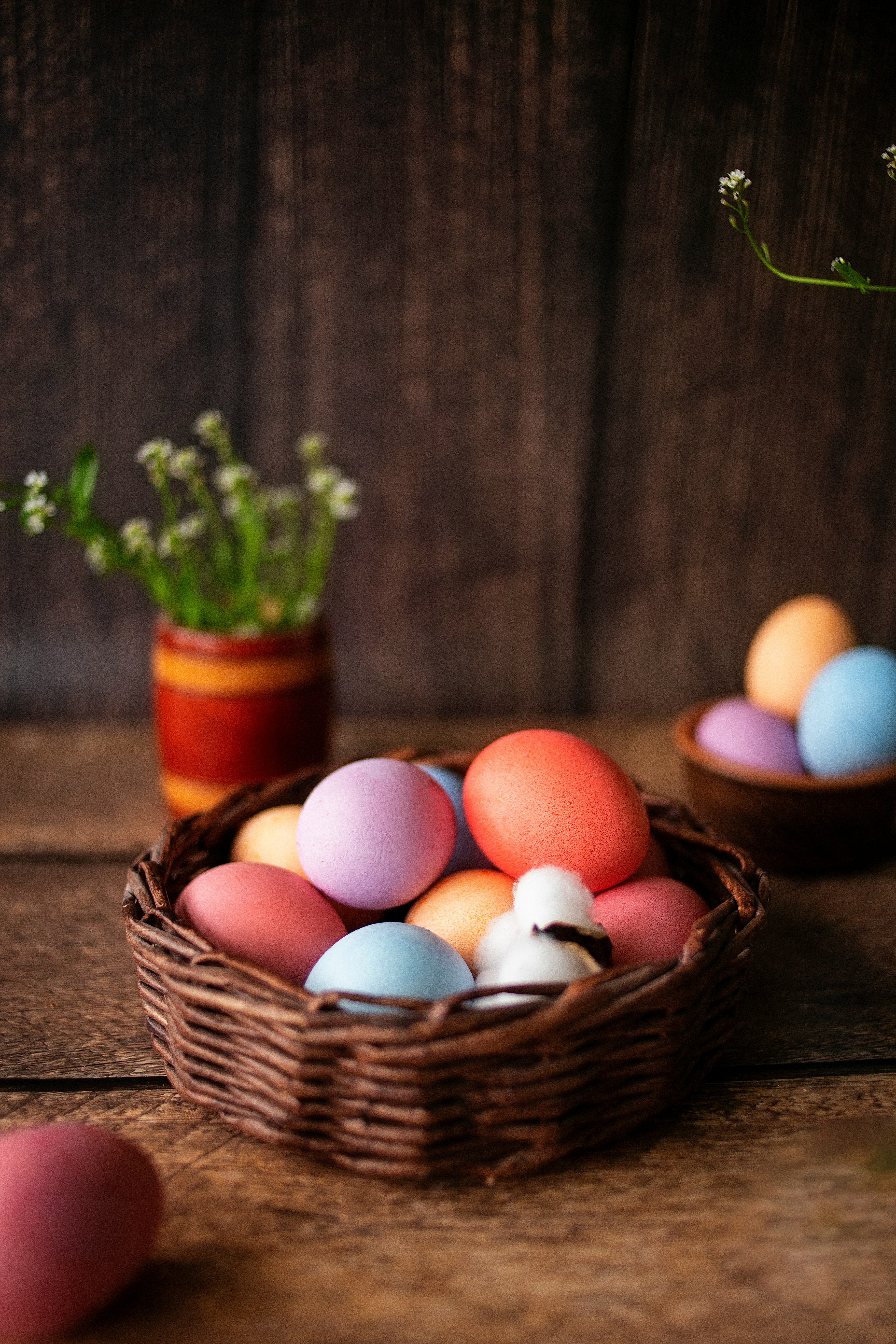 A basket of fresh, colorful pasture-raised eggs.